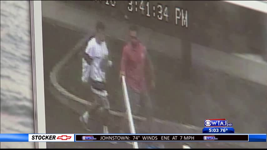 Two men caught on camera vandalizing library parking lot_09311147-159532