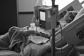 Patient in hospital bed_1477000934935.jpg