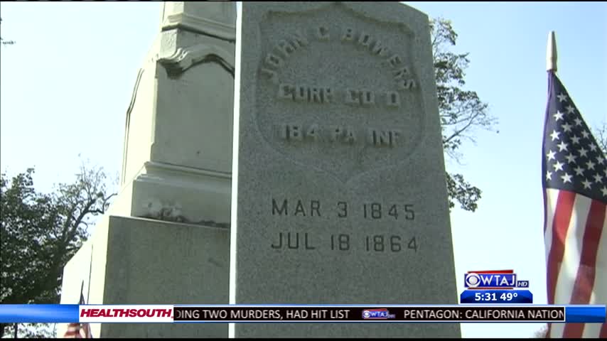 Volunteers fix tombstones_38071120-159532