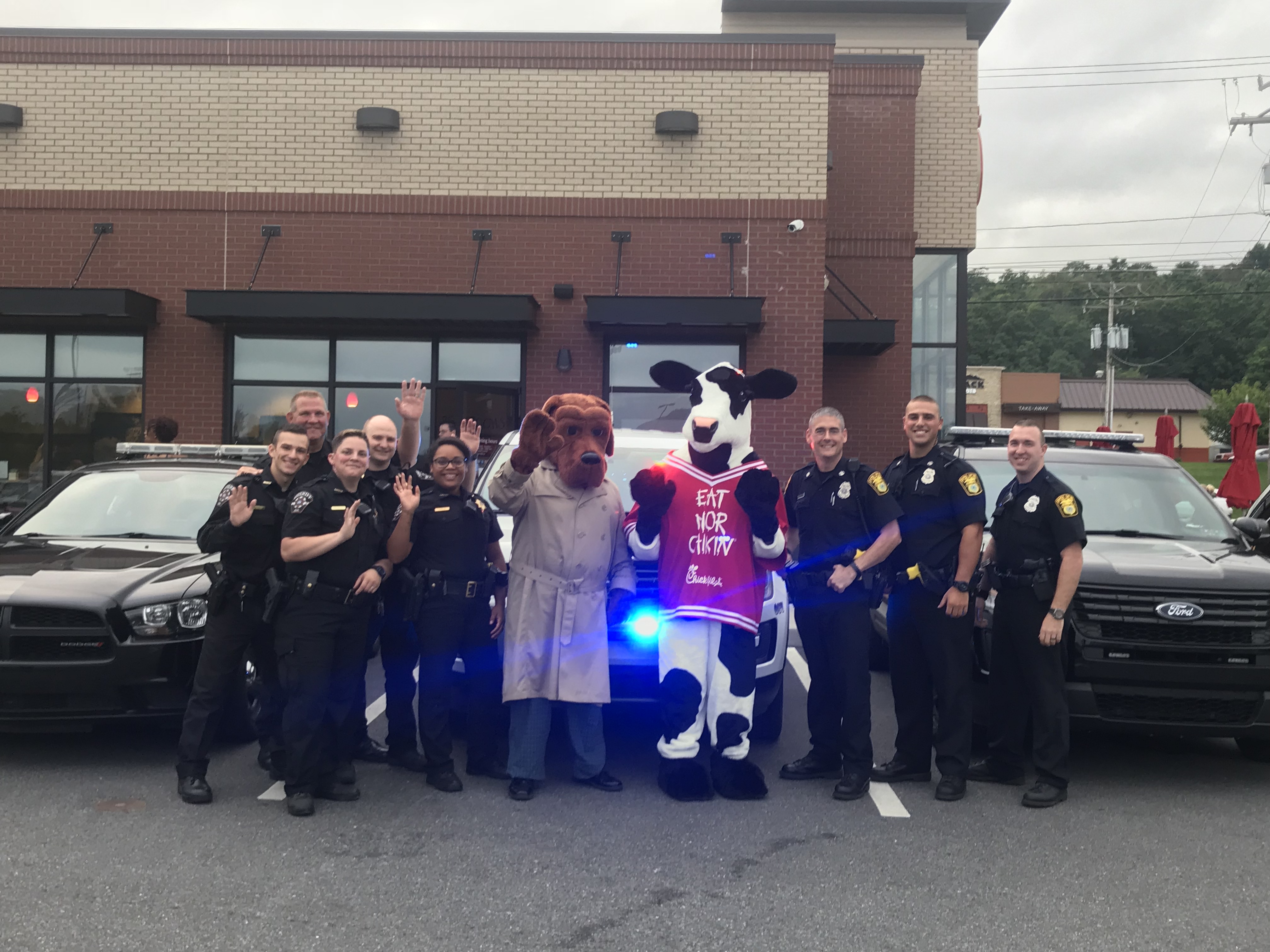 Local kids join law enforcement at Chick fil A_1534881730350.jpg.jpg