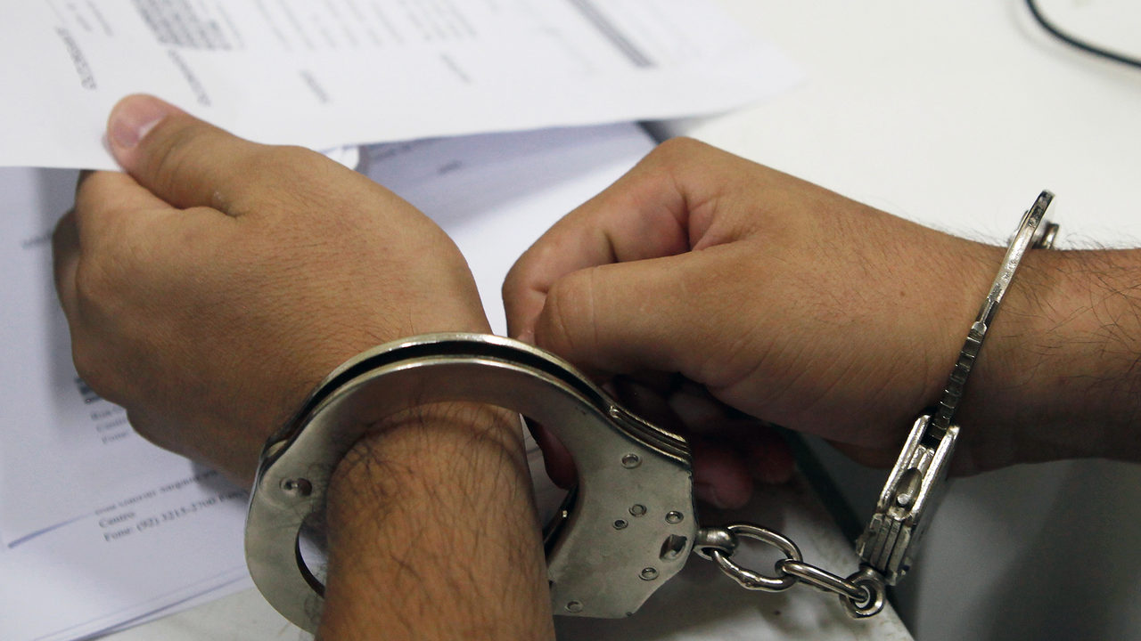 Person arrested in handcuffs_Getty Images_1556924919581.jpg.jpg